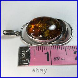 Amber Pendant Sterling Silver. 925 Golden Jeweler's Marks Brown