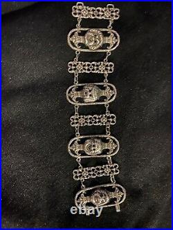 Antique Sterling silver Peruzzi style large bracelet decorated with Masks marked