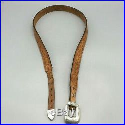 LOOK! A Navajo Guild Marked Sterling Silver Buckle Set on a Tooled Leather Belt