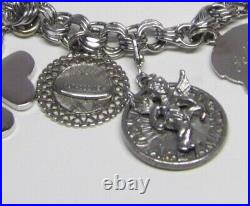 Marked JB sterling charm bracelet with safety chain with 9 charms vintage