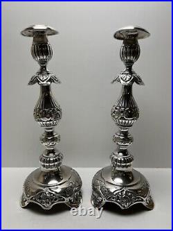 Ornate silver candlesticks marked sterling 84 pair of silver candlesticks