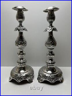 Ornate silver candlesticks marked sterling 84 pair of silver candlesticks