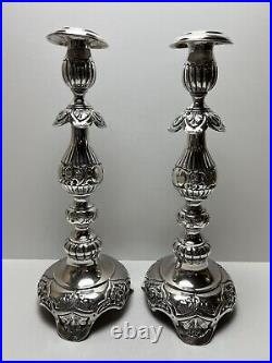 Ornate silver candlesticks marked sterling 84 pair of silver candlesticks