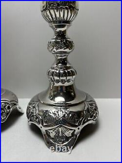 Ornate silver candlesticks marked sterling 84 pair of silver candlesticks