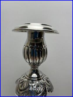 Ornate silver candlesticks marked sterling 84 pair of silver candlesticks