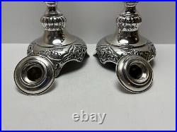 Ornate silver candlesticks marked sterling 84 pair of silver candlesticks