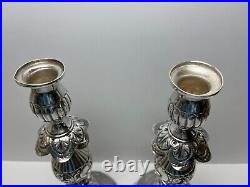 Ornate silver candlesticks marked sterling 84 pair of silver candlesticks