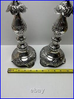 Ornate silver candlesticks marked sterling 84 pair of silver candlesticks