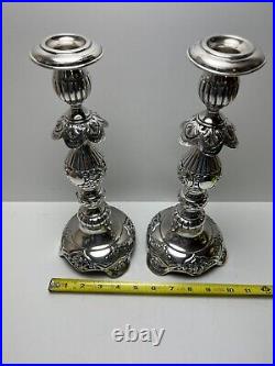 Ornate silver candlesticks marked sterling 84 pair of silver candlesticks