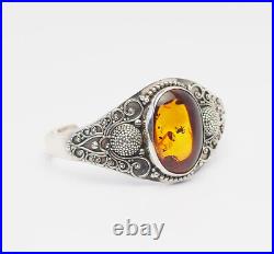 Ornate wide sterling silver and amber cuff bracelet