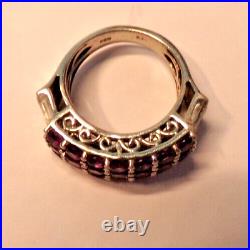 Sterling Silver Ring Marked 925 7 rows purple stones and baguette stones 5.25